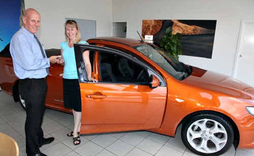 Ian Cunningham of Q Ford in Springwood presents Michelle Webber with the keys to her new car. Ian Cunningham of Q Ford in Springwood presents Michelle Webber with the keys to her new car.